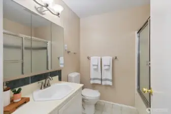 Full bath on the main level between the primary and second bedroom.