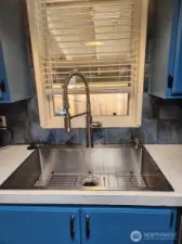 Upgraded stainless steel sink and faucet.