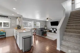 Textured plank  laminate flooring throughout most of home