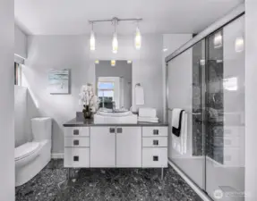 Primary bath with quartz counter vanity.