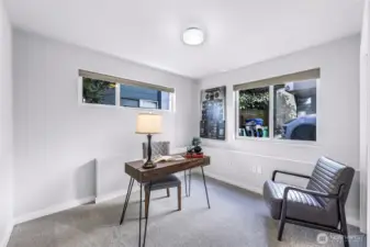 First downstairs bedroom or office to the right of the front door.