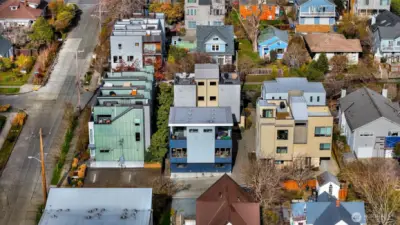 Drone shot of the townhome in the middle.