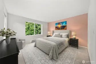 A well-sized primary bedroom with space to relax and unwind at the end of the day~