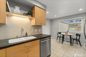 The kitchen overlooks the sunny eating nook.