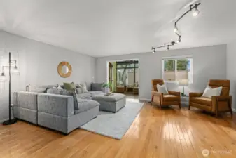 The living room offers easy access to the sunroom via French doors.