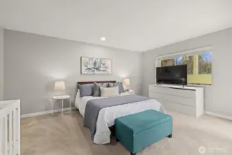 The primary bedroom feels secluded and private. It's a sizeable room.