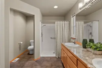 Primary Bath with easy walk-in shower, private water closet.