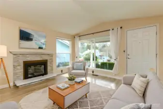 Variation of living room and entry way. Gas fireplace, plenty of natural lighting and vaulted ceilings.