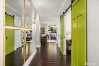 As you enter the home there is a living room and bedroom (set up as an office). Gleaming hardwood floors greet you in the thoughtfully designed home.