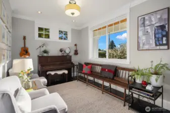 This is the first room off the entry currently being used as the piano room.