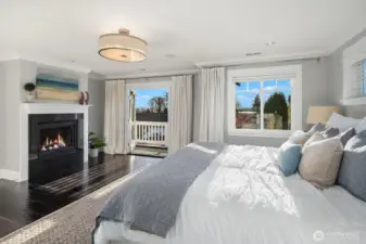 Spacious primary suite with views of the lake, city and mountains.