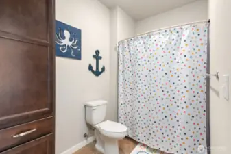 Toilet and shower of upstairs bathroom