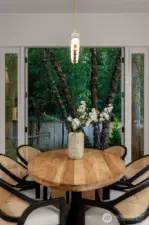 Enjoy beautiful views of lush, private back yard while dining.