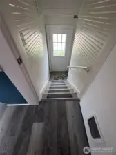 Looking down towards the back door and basement steps.