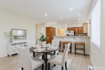 The dining area provides the perfect place to enjoy your favorite meal, with breakfast bar for extra seating.