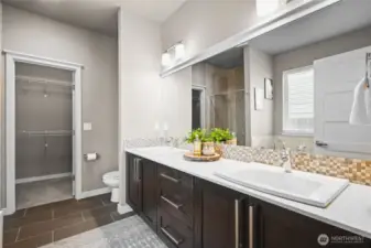 Luxurious 5-piece bath complete with a soaking tub, dual vanities, walk-in shower, and elegant finishes throughout.
