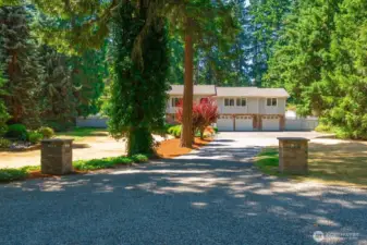 Sitting back off the road you can feel your self decompress as you enter the long driveway towards your home