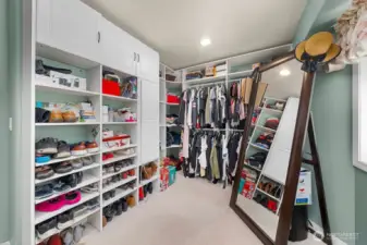 Closet space that feels like an extra room. Plenty of shelves and hanging space oh and big enough to change in and check yourself in the mirror. Don't miss the ironing board in the built in