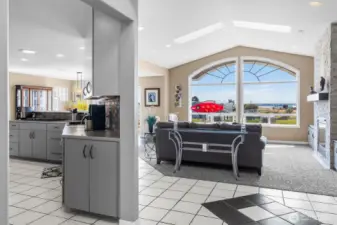 The large entry way flows right into the living area and the kitche.