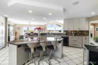 Large island in the middle of the kitchen is perfect for casual entertaining and is great for cooling off all those cookies!