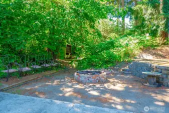 Cozy Fire pit at the back of the property adds a layer of seclusion while you gather round and enjoy your smores after a day of swimming!