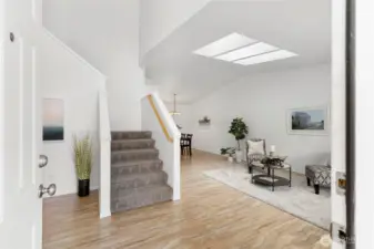 Beautiful Foyer with Laminate Flooring. Vaulted Ceilings in the Living Room with Skylights