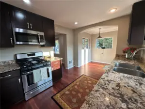 UPDATED KITCHEN & CABINETS, KITCHEN NOOK, DOOR FRENCH DOORS OUT TO THE SPACIOUS DECK.