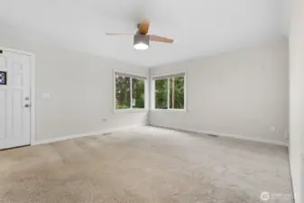 Bright and welcoming living room right off the main entrance