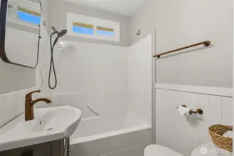 Updated bathroom featuring new sink, beadboard and light fixture