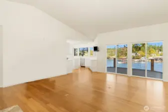 Great room w/ bamboo floors to covered deck & well-appointed kitchen.