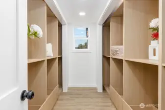 Huge custom walk-in closet to primary bedroom.