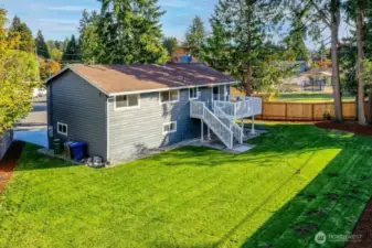 This spacious yard has confirmed eligibility under renton's Permit-Ready ADU program. On the other side of the fence is a curb cut with ready separate access.
