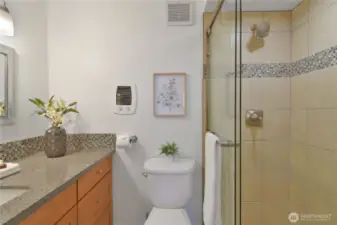 Secondary bath with glass enclosed shower