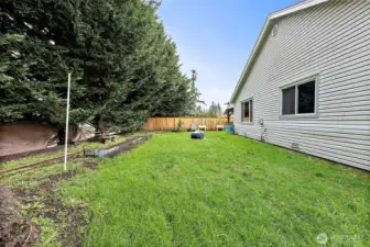 Abundant space for gardening, raised beds, and outdoor enjoyment.