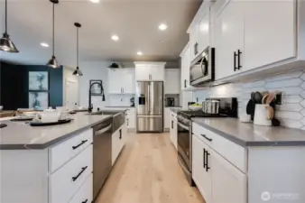 Photos of Model Home of Plan 2473 Elevation B at another community.  Details and colors will vary from home to home. No two homes are exact. Ask Broker for color selections for the listed property