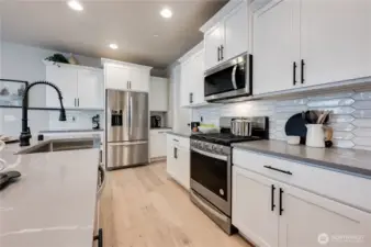 Photos of Model Home of Plan 2473 Elevation B at another community.  Details and colors will vary from home to home. No two homes are exact. Ask Broker for color selections for the listed property