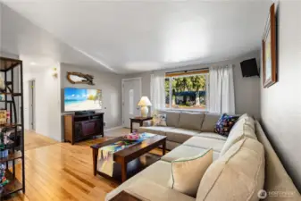 The living room captures northeast exposure and offers a cozy haven.