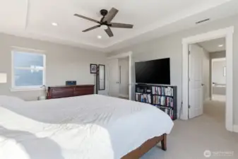 The primary bedroom features a seamless entrance to the ensuite bath. This thoughtful layout enhances comfort while maintaining a luxurious and cohesive design.