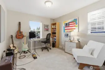 Second guest room on the upper level enjoys natural light and comfortable surroundings.