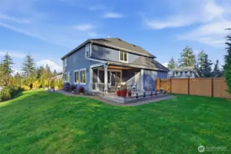 The side yard offers a charming view of the home, showcasing its architectural details and landscaped surroundings. This perspective highlights both the beauty and thoughtful design of the property.