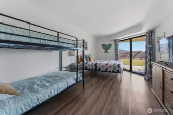 Lower Level Bedroom w/access to patio & lawn area