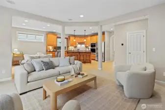 Kitchen flows seamlessly into family room with 2nd gas fireplace, built-in cabinetry perfect for storage, and pre-wired in ceiling speakers
