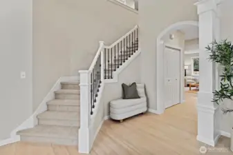 Beautiful sweeping staircase to upstairs with 4 of 5 bedrooms and large bonus/rec room. New carpet/paint/refinished hardwoods throughout.