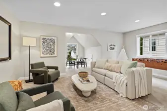 Upstairs bonus room with additional seating nook and plenty of space for movie nights, game nights, and more!