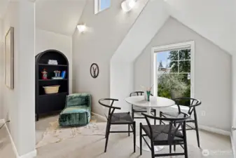 Upstairs bonus room with additional seating nook and plenty of space for movie nights, game nights, and more!