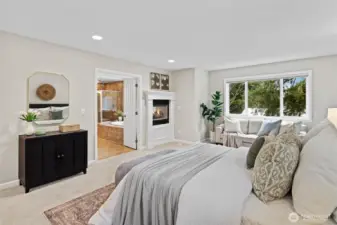 Large Primary Bedroom (Bed #5) with dual sided gas fireplace and spa inspired 5-piece ensuite