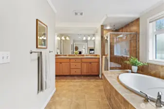 Spa inspired 5-piece ensuite with soaking tub, dual sided fireplace, rain shower head