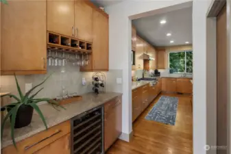 Butler's pantry and large walk-in pantry lead to the large kitchen