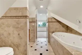 Primary bathroom, view from loft to bedroom