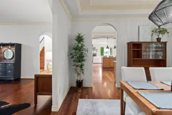 Dining room looking into kitchen and living room.